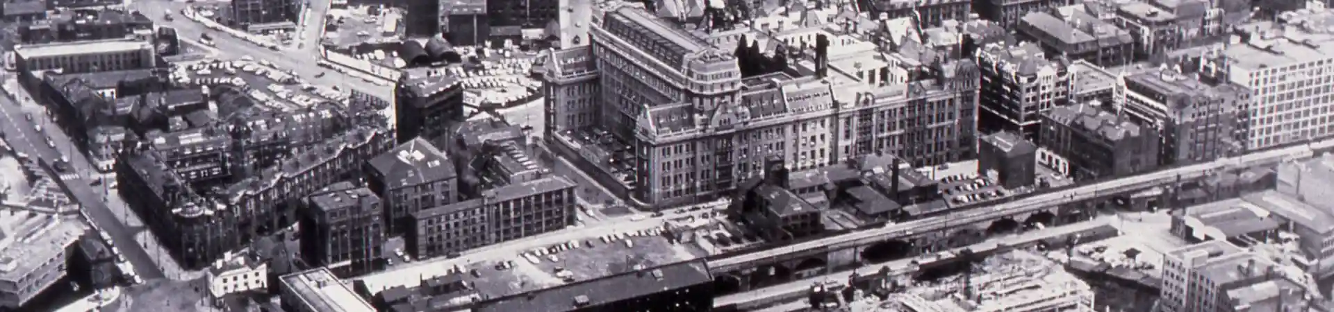A scan of an old photograph of the aerial view over The University of Manchester campus