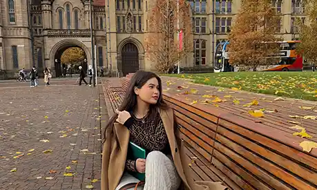 Zhansaya Kenzhegariyeva sat outside the university