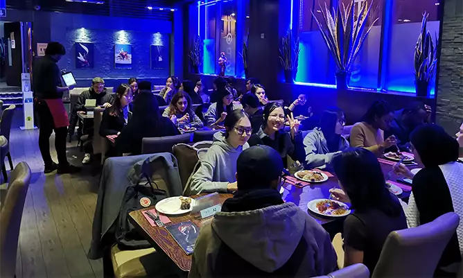 Hoi Kit and his friends in a restaurant