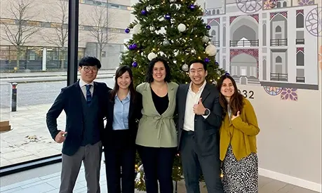 students in front of tree