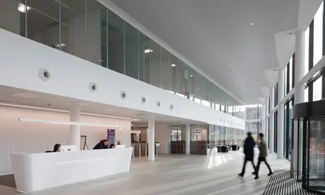 The AMBS reception with people walking through the front doors.