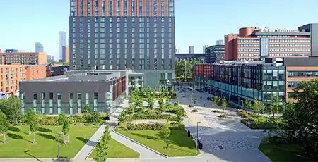 An image of the Alliance Manchester Business School during a sunny day.