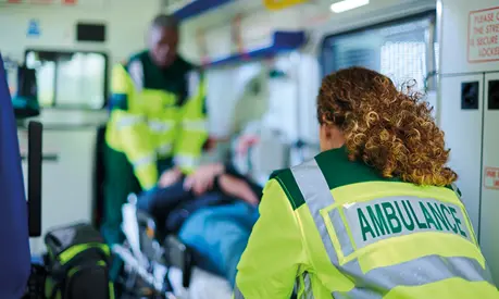 Ambulance crew preparing casualty