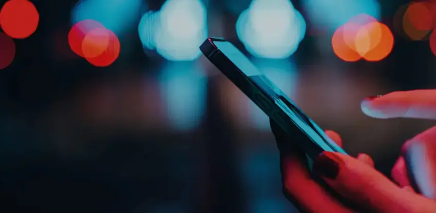 A close up of a person holding a phone in their hands