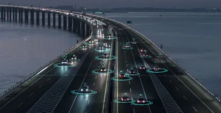 A graphic of cars driving down a motorway with icons above them symbolising the use of technology and AI.