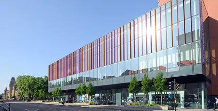 The Alliance MBS and University of Manchester buildings as seen from Oxford Road.