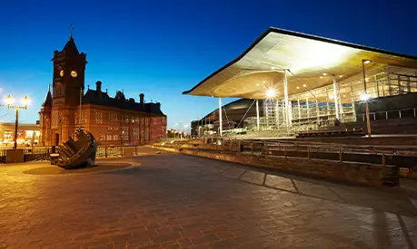 Night shot of the Senedd and Pierhead building
