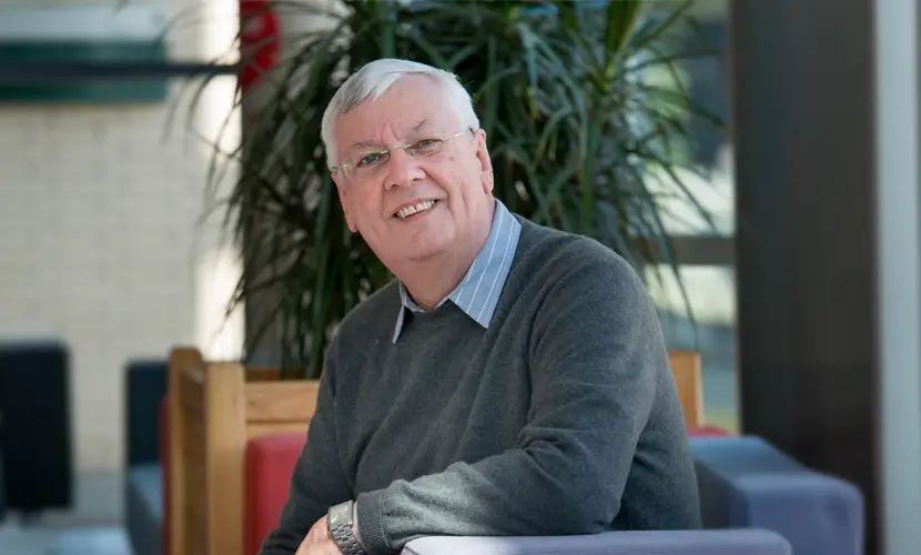 Peter Buckley sat in a chair
