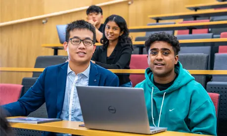 Four students in a lecture theatre.